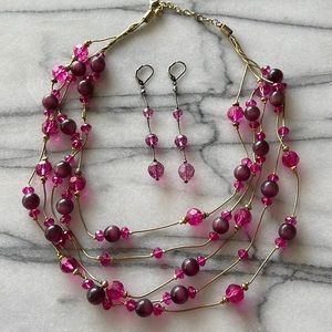 Pink beaded 5 strands neck and earrings.